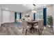 Dining area with wood table, light-colored chairs, and gray floors at 1715 W Satinwood Dr, Phoenix, AZ 85045