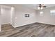 Long hallway with wood-look floors and neutral walls at 1715 W Satinwood Dr, Phoenix, AZ 85045