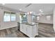 Kitchen island with granite countertop and stainless steel dishwasher at 1715 W Satinwood Dr, Phoenix, AZ 85045