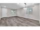 Bright living room with gray vinyl flooring and large window at 1715 W Satinwood Dr, Phoenix, AZ 85045