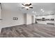 Living room with hardwood floors and open concept kitchen at 1715 W Satinwood Dr, Phoenix, AZ 85045