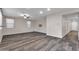 Bright living room with wood-look floors and neutral walls at 1715 W Satinwood Dr, Phoenix, AZ 85045