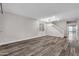 Spacious living room with gray vinyl flooring and staircase at 1715 W Satinwood Dr, Phoenix, AZ 85045