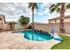 Stunning kidney-shaped pool with a water feature and basketball hoop at 1715 W Satinwood Dr, Phoenix, AZ 85045