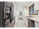 Modern kitchen with black appliances and white cabinets at 17243 N 16Th St # 1, Phoenix, AZ 85022