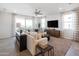 Relaxing living room with large TV and plenty of natural light at 17299 W Dahlia Dr, Surprise, AZ 85388