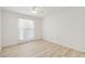 Light-filled bedroom featuring wood-look floors at 17635 N Buntline Dr, Sun City West, AZ 85375