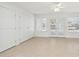 Bright bedroom with neutral walls and tile flooring at 17635 N Buntline Dr, Sun City West, AZ 85375