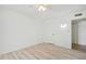 Simple bedroom with wood-look floors and ceiling fan at 17635 N Buntline Dr, Sun City West, AZ 85375