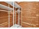 Closet with cedar walls and modern shelving unit at 17635 N Buntline Dr, Sun City West, AZ 85375