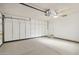 Garage with ample storage and ceiling fan at 17635 N Buntline Dr, Sun City West, AZ 85375