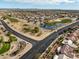 Elevated aerial shot of the golf course winding through the community, complete with ponds and manicured greens at 17635 N Buntline Dr, Sun City West, AZ 85375