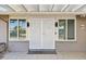 Front entry with white double doors and security screen at 17635 N Buntline Dr, Sun City West, AZ 85375