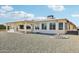 Back exterior view, showcasing a covered patio at 17635 N Buntline Dr, Sun City West, AZ 85375