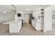 Modern white kitchen with new appliances and breakfast bar at 17635 N Buntline Dr, Sun City West, AZ 85375