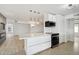 Modern kitchen with white cabinets and stainless steel appliances at 17635 N Buntline Dr, Sun City West, AZ 85375