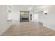 Living room with fireplace and wood-look flooring at 17635 N Buntline Dr, Sun City West, AZ 85375