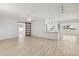 Living room featuring wood-look floors and barn door at 17635 N Buntline Dr, Sun City West, AZ 85375