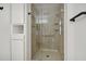 Walk-in shower with glass enclosure and shelves at 17635 N Buntline Dr, Sun City West, AZ 85375