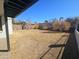 Large backyard with grassy area and mature trees at 1839 E Indigo St, Mesa, AZ 85203