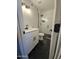 Modern bathroom with white vanity and hexagon tile flooring at 1839 E Indigo St, Mesa, AZ 85203