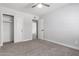 Bedroom with carpet, ceiling fan, and closet space at 1839 E Indigo St, Mesa, AZ 85203