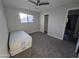 Well-lit bedroom with carpet, ceiling fan and mirrored closet doors at 1839 E Indigo St, Mesa, AZ 85203