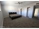 Spacious bedroom with a king bed and ample closet space at 1839 E Indigo St, Mesa, AZ 85203