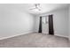 Carpeted bedroom with window and dark curtains for privacy at 1839 E Indigo St, Mesa, AZ 85203