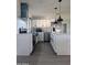 Modern kitchen with white cabinets, a large island, and stainless steel appliances at 1839 E Indigo St, Mesa, AZ 85203