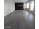 Living room with fireplace and hardwood floors at 1839 E Indigo St, Mesa, AZ 85203