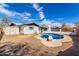 Backyard features a sparkling pool perfect for hot days, and an outdoor storage shed at 1839 E Indigo St, Mesa, AZ 85203