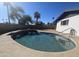 Inviting kidney-shaped pool with a concrete deck at 1839 E Indigo St, Mesa, AZ 85203