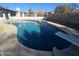 Inviting kidney-shaped pool with diving board, ready for summer fun at 1839 E Indigo St, Mesa, AZ 85203