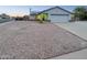 House exterior featuring a two-car garage and landscaping at 19002 N 47Th Dr, Glendale, AZ 85308