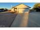 Single-story home with a two-car garage and a well-maintained front yard at 19002 N 47Th Dr, Glendale, AZ 85308