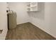 Bright laundry room with shelving and vinyl flooring at 19002 N 47Th Dr, Glendale, AZ 85308