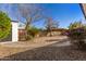 Landscaped backyard with a curved path at 19819 N 6Th Dr, Phoenix, AZ 85027