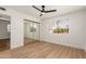 Bright bedroom featuring mirrored closet doors and wood-look floors at 19819 N 6Th Dr, Phoenix, AZ 85027