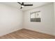 Simple bedroom with ceiling fan and window coverings at 19819 N 6Th Dr, Phoenix, AZ 85027