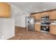 Modern kitchen with stainless steel appliances and light wood cabinets at 19819 N 6Th Dr, Phoenix, AZ 85027