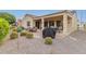 Landscaped backyard with patio and gravel at 20359 N 262Nd Dr, Buckeye, AZ 85396