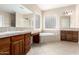 Bathroom with double vanity, soaking tub, and glass block window at 20359 N 262Nd Dr, Buckeye, AZ 85396