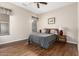 Bedroom with wood flooring, ceiling fan, and window coverings at 20359 N 262Nd Dr, Buckeye, AZ 85396