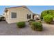 Back exterior of house with landscaping at 20359 N 262Nd Dr, Buckeye, AZ 85396