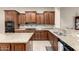 Modern kitchen with granite countertops and double sink at 20359 N 262Nd Dr, Buckeye, AZ 85396