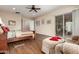 Main bedroom with sitting area and sliding glass doors at 20359 N 262Nd Dr, Buckeye, AZ 85396