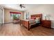 Large main bedroom with wood flooring and ceiling fan at 20359 N 262Nd Dr, Buckeye, AZ 85396