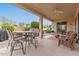 Covered patio with seating area and backyard access at 20359 N 262Nd Dr, Buckeye, AZ 85396