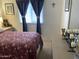 Bright bedroom with comfortable bed and window coverings at 205 S Higley Rd # 299, Mesa, AZ 85206